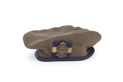 Lot 332 - ﻿﻿A selection of British military berets with badges; and an army officers peaked cap