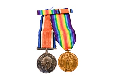 Lot 216 - A pair of First World War general service medals; and two cap badges