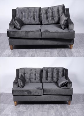 Lot 118 - Retailed by Absolute Interiors: a pair of contemporary button back two-seater sofas