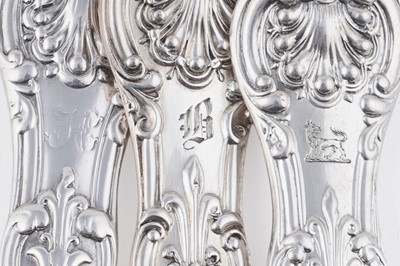 Lot 129 - A quantity of antique silver Queen’s pattern (honeysuckle heel) flatware