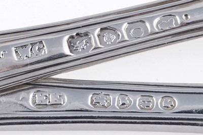 Lot 129 - A quantity of antique silver Queen’s pattern (honeysuckle heel) flatware