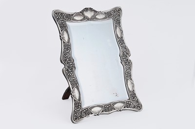 Lot 48 - An Edwardian silver dressing table mirror