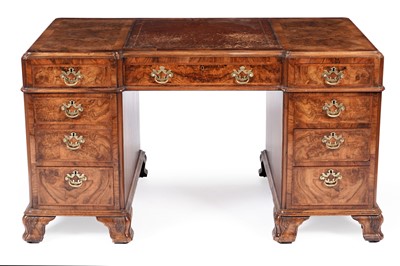 Lot 1069 - An early 20th Century Georgian style burr walnut kneehole desk