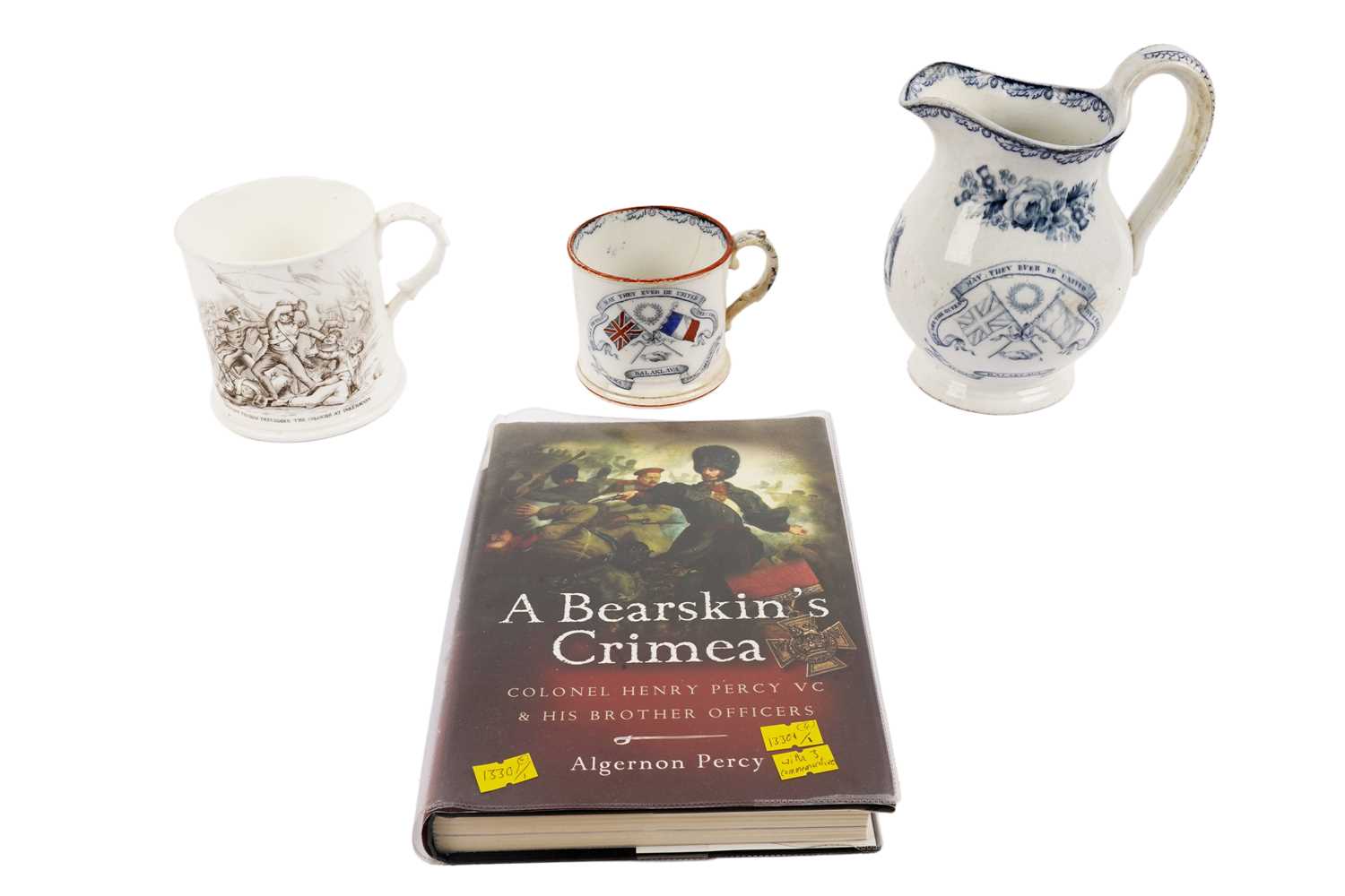 Lot 118 - Three pieces of Staffordshire pottery; and a signed book commemorating the Crimean War