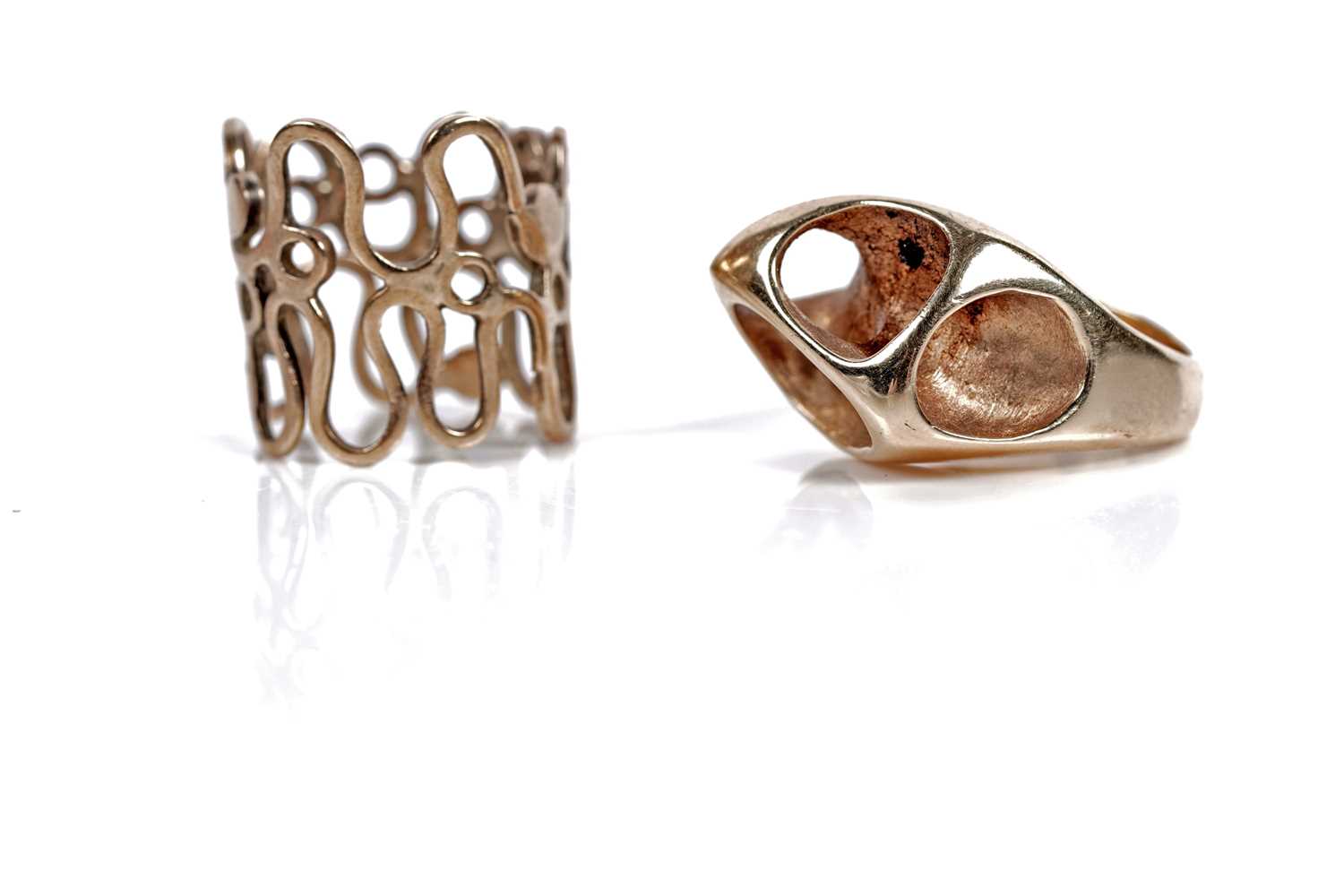 Lot 529 - Two Mid-Century and Modern style gold rings