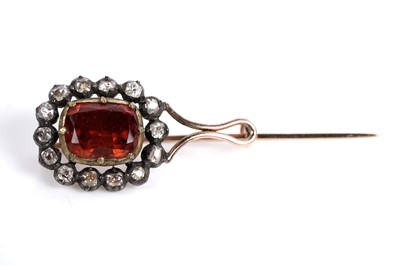 Lot 523 - A Georgian spessartine garnet and diamond brooch