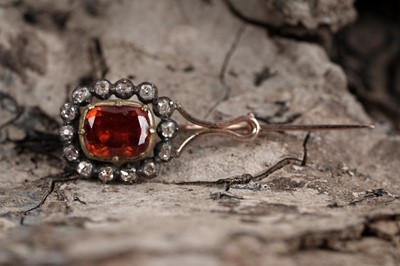 Lot 523 - A Georgian spessartine garnet and diamond brooch