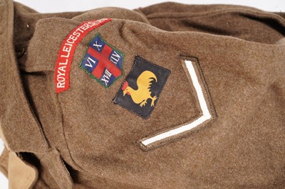 Lot 331 - A Second World War battledress tunic; and other items
