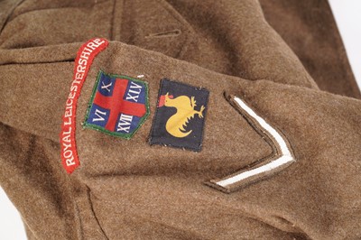 Lot 331 - A Second World War battledress tunic; and other items