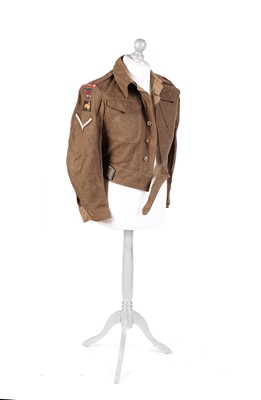 Lot 331 - A Second World War battledress tunic; and other items