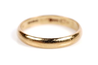 Lot 525 - A ruby and diamond ring; and an 18ct gold wedding band