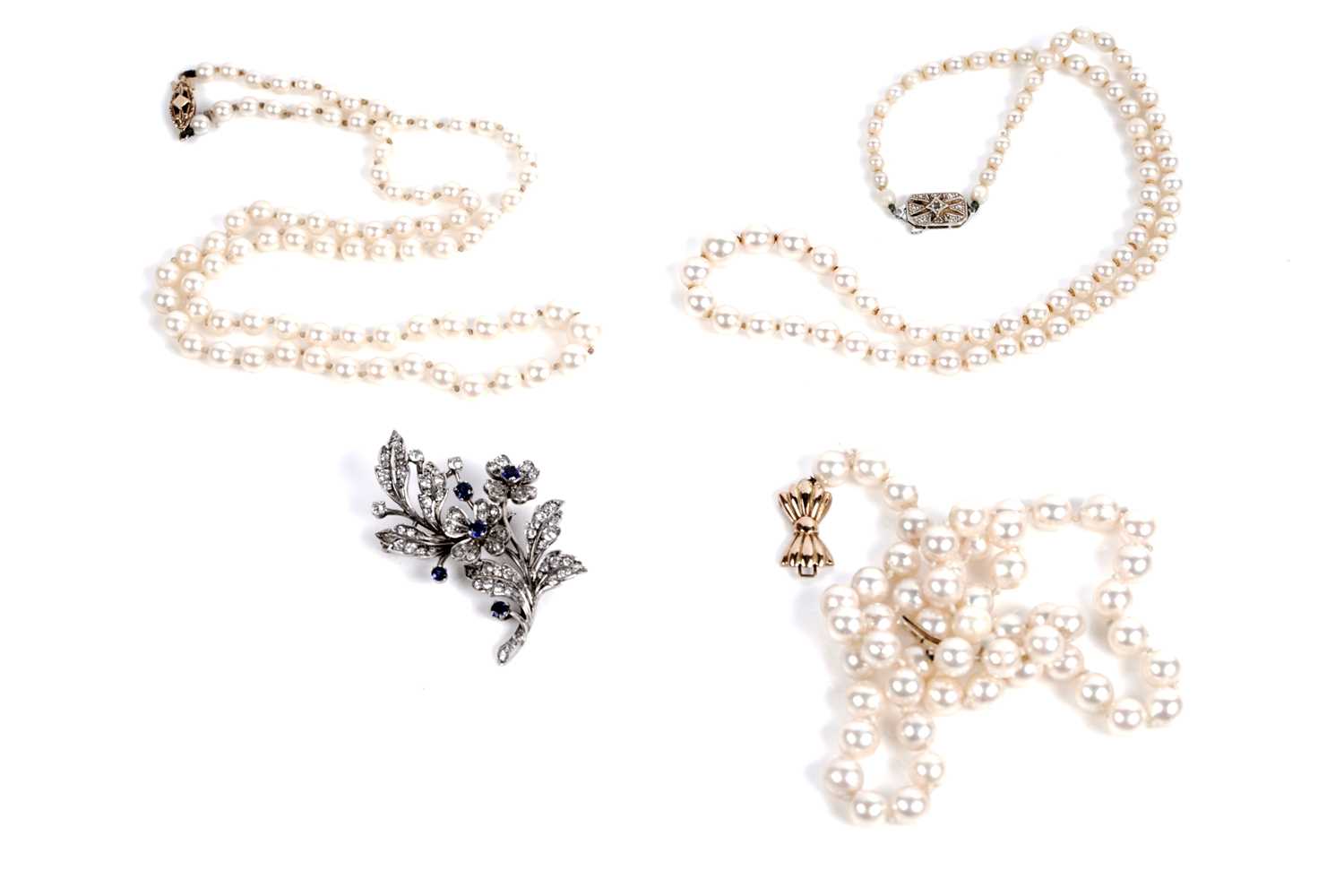 Lot 559 - Pearl necklaces; and a synthetic sapphire floral spray brooch