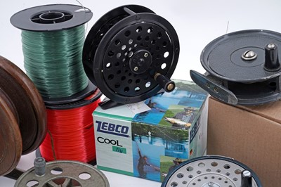 Lot 189 - A collection of fishing reels and landing nets