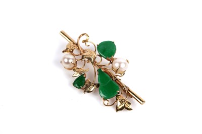 Lot 543 - A jadeite and pearl foliate pattern brooch