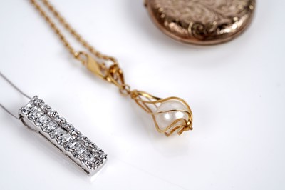 Lot 572 - Pendants and necklaces including: a captive pearl and antique locket