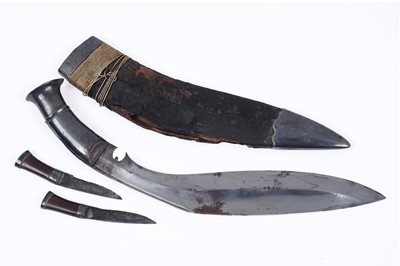 Lot 307 - A kukri with white metal grip; and two similar chakmak