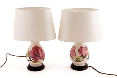 Lot 185 - A pair of Moorcroft ‘Pink Magnolia’ table lamps