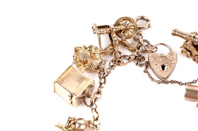 Lot 128 - A 9ct gold charm bracelet