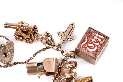 Lot 128 - A 9ct gold charm bracelet