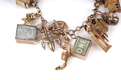 Lot 128 - A 9ct gold charm bracelet