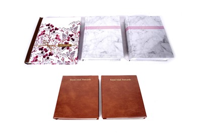 Lot 100 - Two albums of postcards; and three photograph albums