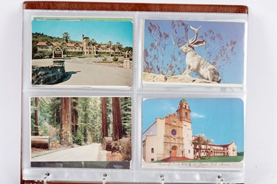 Lot 100 - Two albums of postcards; and three photograph albums
