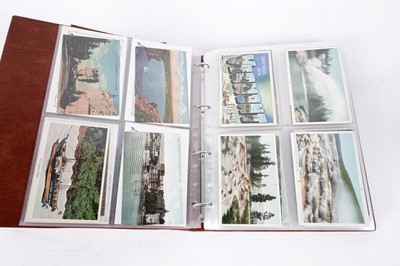 Lot 100 - Two albums of postcards; and three photograph albums