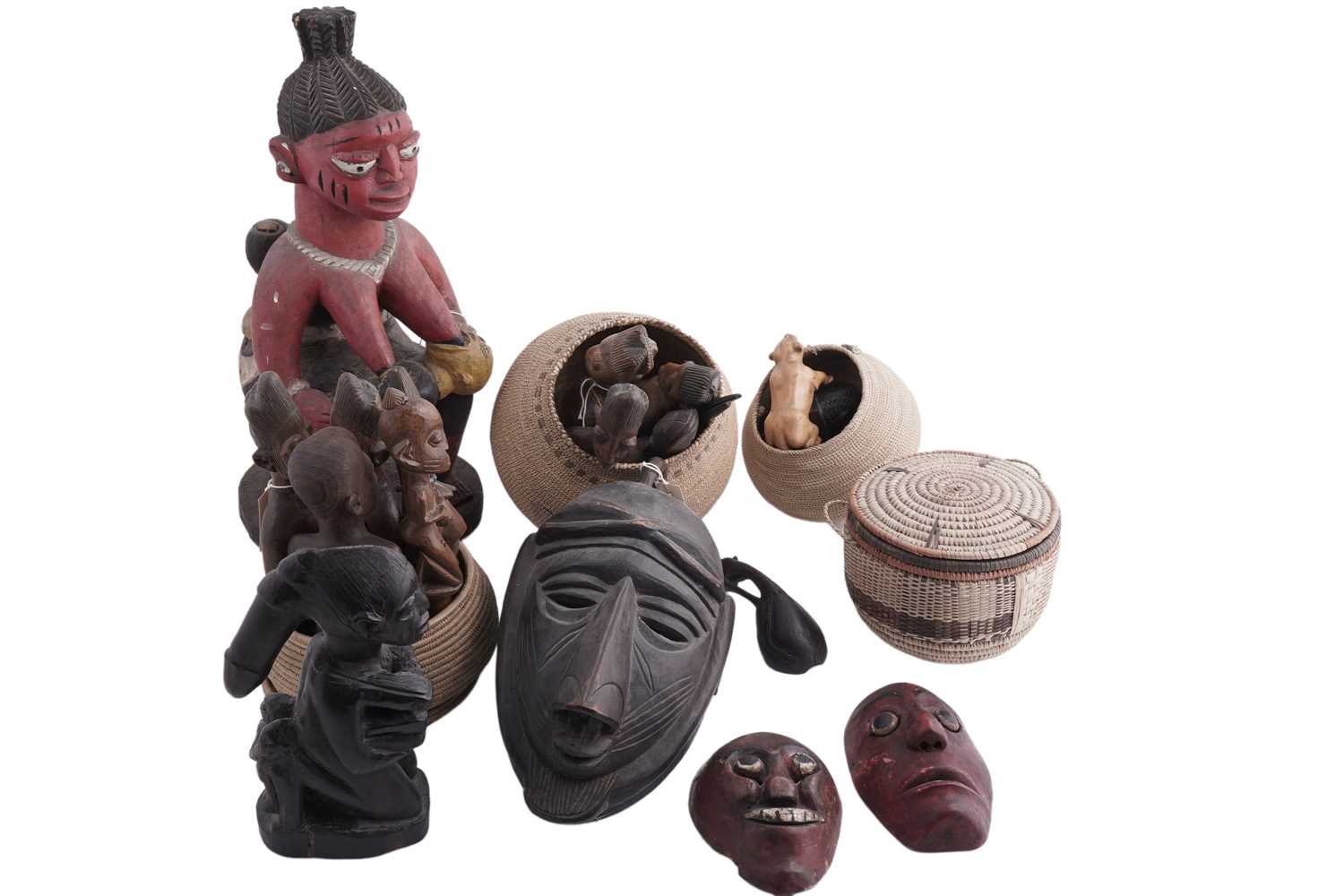 Lot 168 - A collection of 20th Century carved African figures; and four wicker work baskets