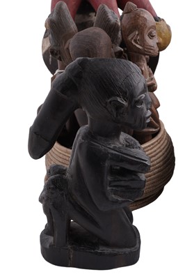 Lot 168 - A collection of 20th Century carved African figures; and four wicker work baskets