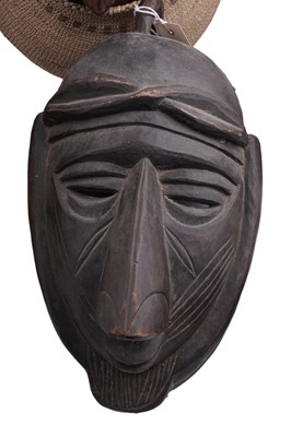 Lot 168 - A collection of 20th Century carved African figures; and four wicker work baskets