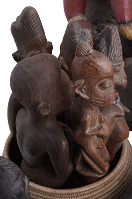 Lot 168 - A collection of 20th Century carved African figures; and four wicker work baskets