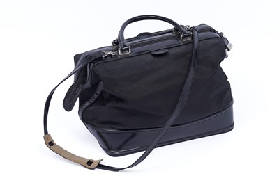 Lot 228 - A Gucci bag of black patent leather and canvas