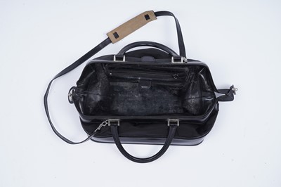 Lot 228 - A Gucci bag of black patent leather and canvas