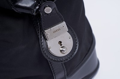 Lot 228 - A Gucci bag of black patent leather and canvas