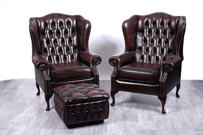 Lot 2 - A pair of Victorian style Chesterfield wingback armchairs and matching ottoman