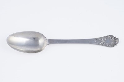 Lot 150 - A Queen Anne silver lace-back trefid spoon