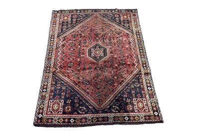 Lot 980 - A Persian hand-knotted Shiraz carpet