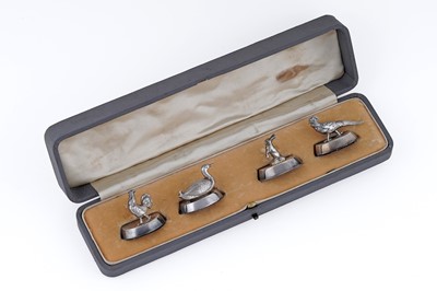 Lot 241 - A George V cased set of four silver menu card holders