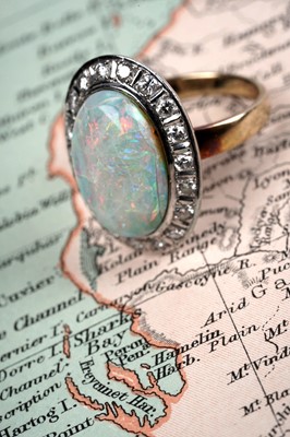 Lot 594 - An opal and diamond cluster ring
