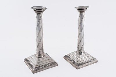 Lot 104 - A pair of late Victorian silver candlesticks