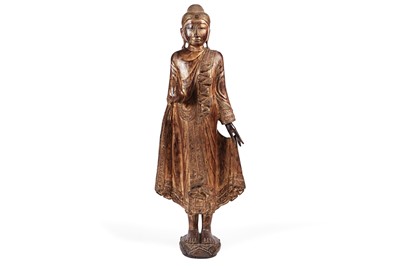 Lot 851 - A Burmese carved and giltwood 'jewelled' figure of Buddha