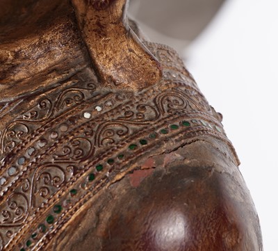 Lot 851 - A Burmese carved and giltwood 'jewelled' figure of Buddha