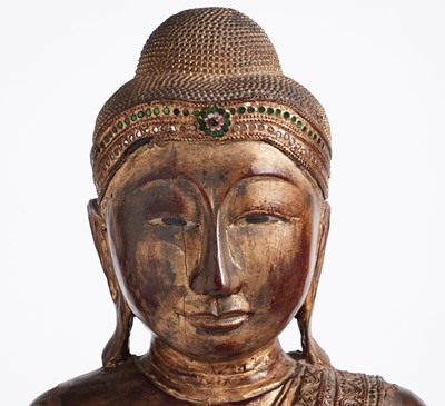 Lot 851 - A Burmese carved and giltwood 'jewelled' figure of Buddha