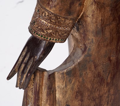 Lot 851 - A Burmese carved and giltwood 'jewelled' figure of Buddha