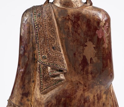 Lot 851 - A Burmese carved and giltwood 'jewelled' figure of Buddha