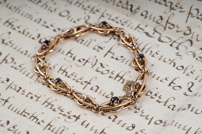 Lot 602 - A late Victorian sapphire and seed pearl bracelet
