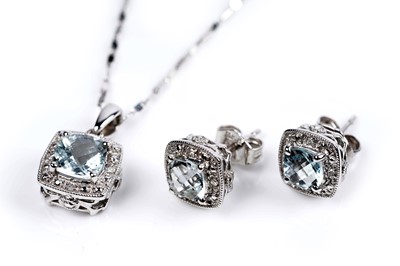 Lot 604 - An aquamarine and diamond pendant and earrings