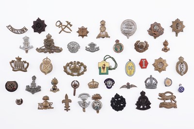 Lot 21 - A selection of regimental cap badges