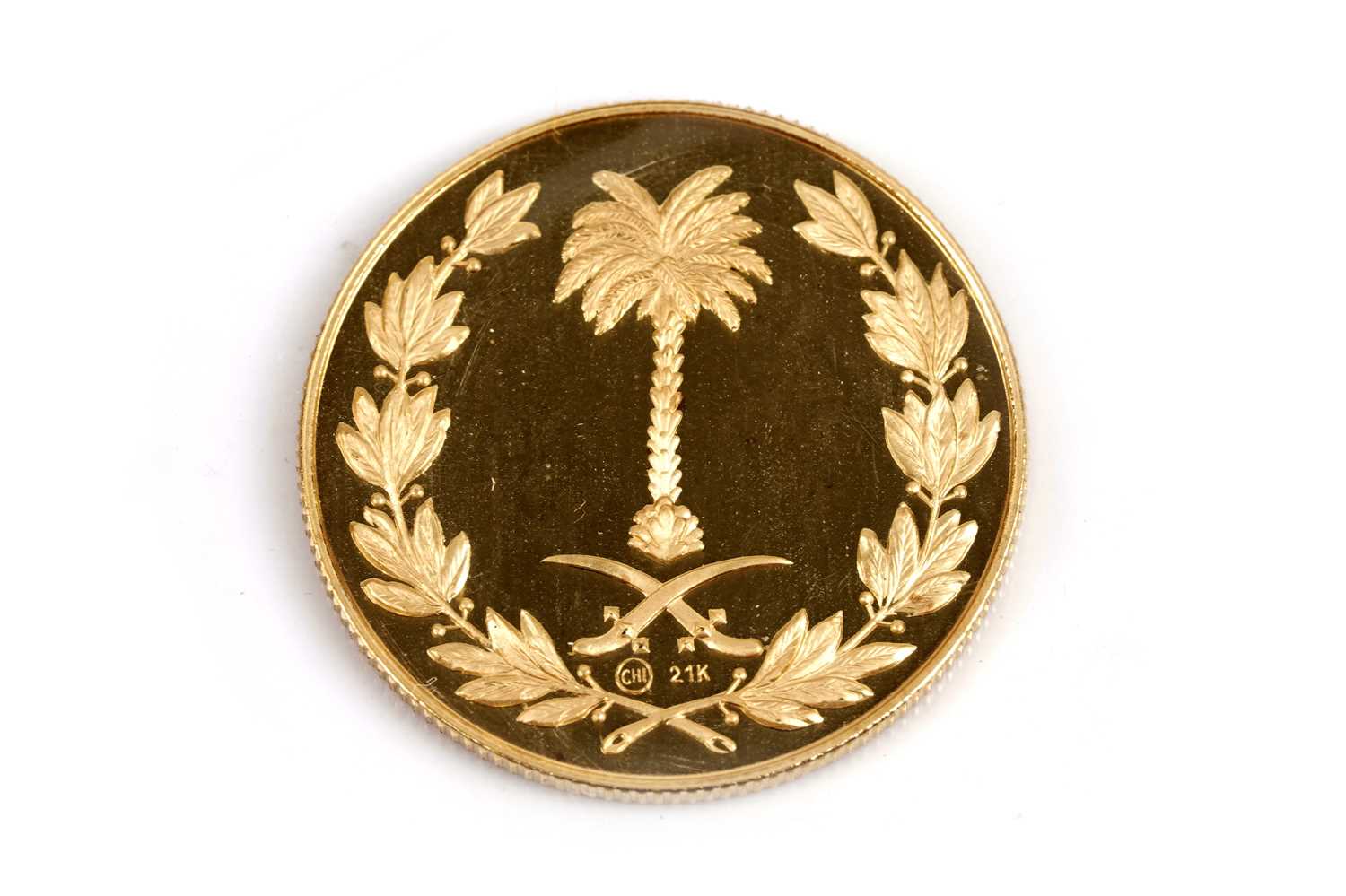 Lot 42 - A Saudi Arabia 21ct yellow gold commemorative coin