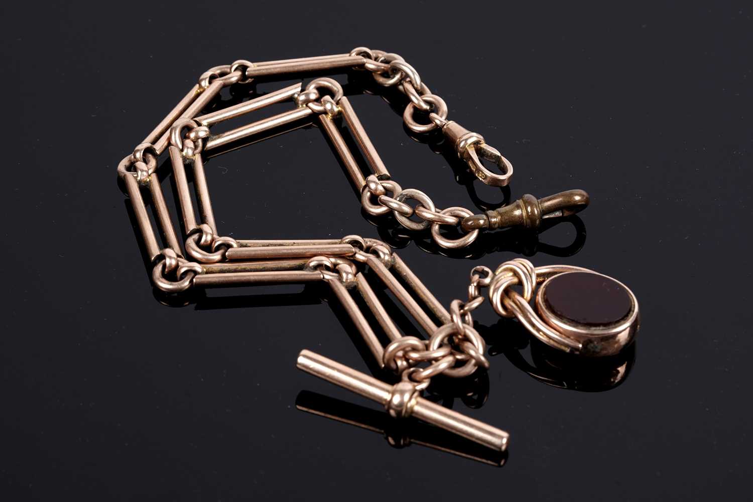 Lot 77 - A 10ct rose gold "Albert" fetter-link watch chain